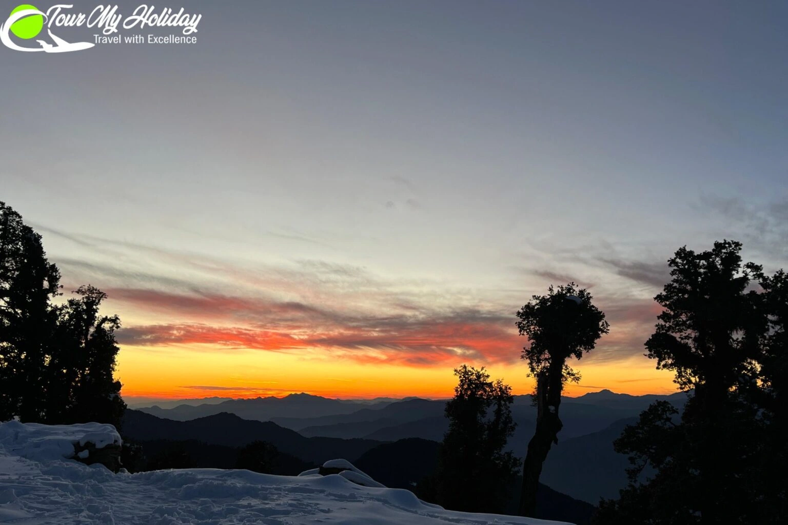Sunset view at Tungnath Temple with golden light falling on Himalayan peaks and forested mountains